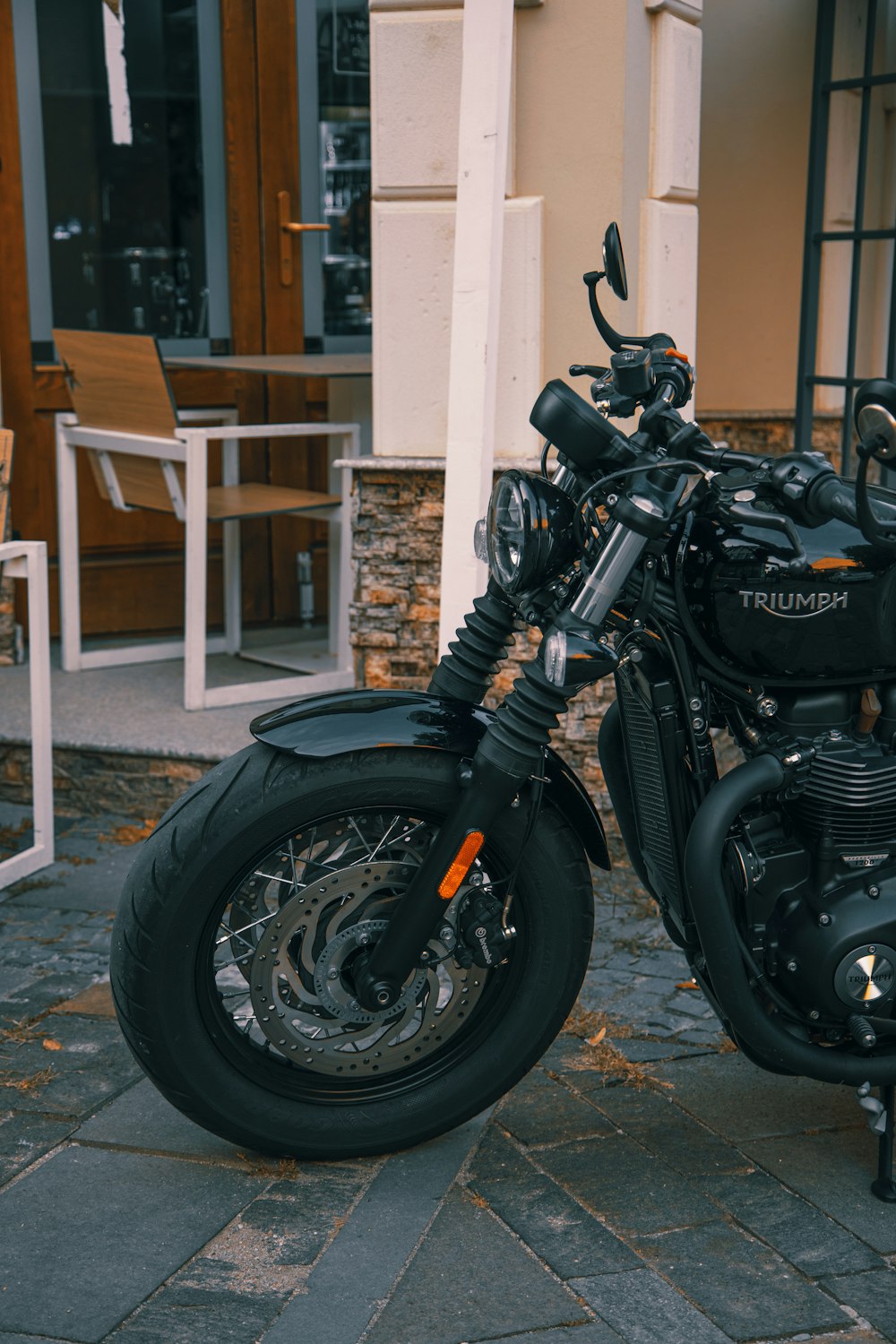 a motorcycle parked on the sidewalk