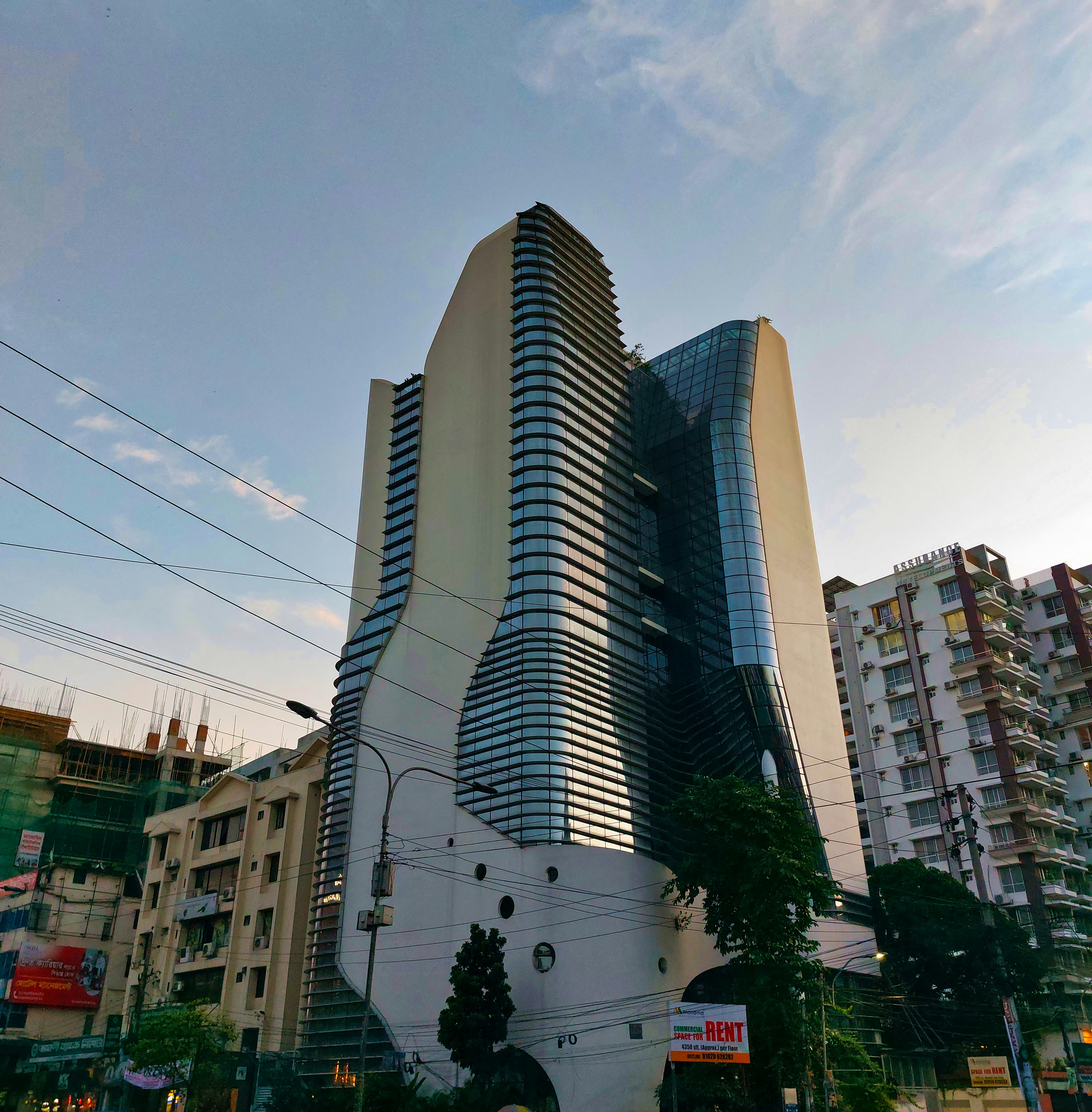 a tall building with a glass front