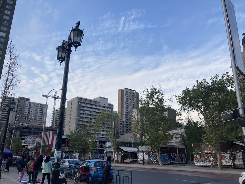 a city street with cars and people