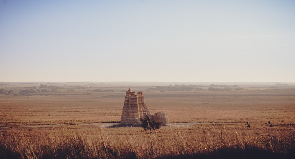 a group of pyramids in a field