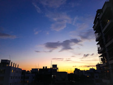 Elegant city skyline at dusk with gold and electric blue highlights.