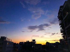 A city skyline at dusk with blue tones, representing growth and opportunity.