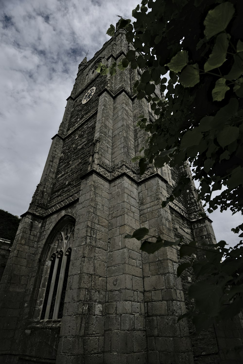 a clock on a stone tower