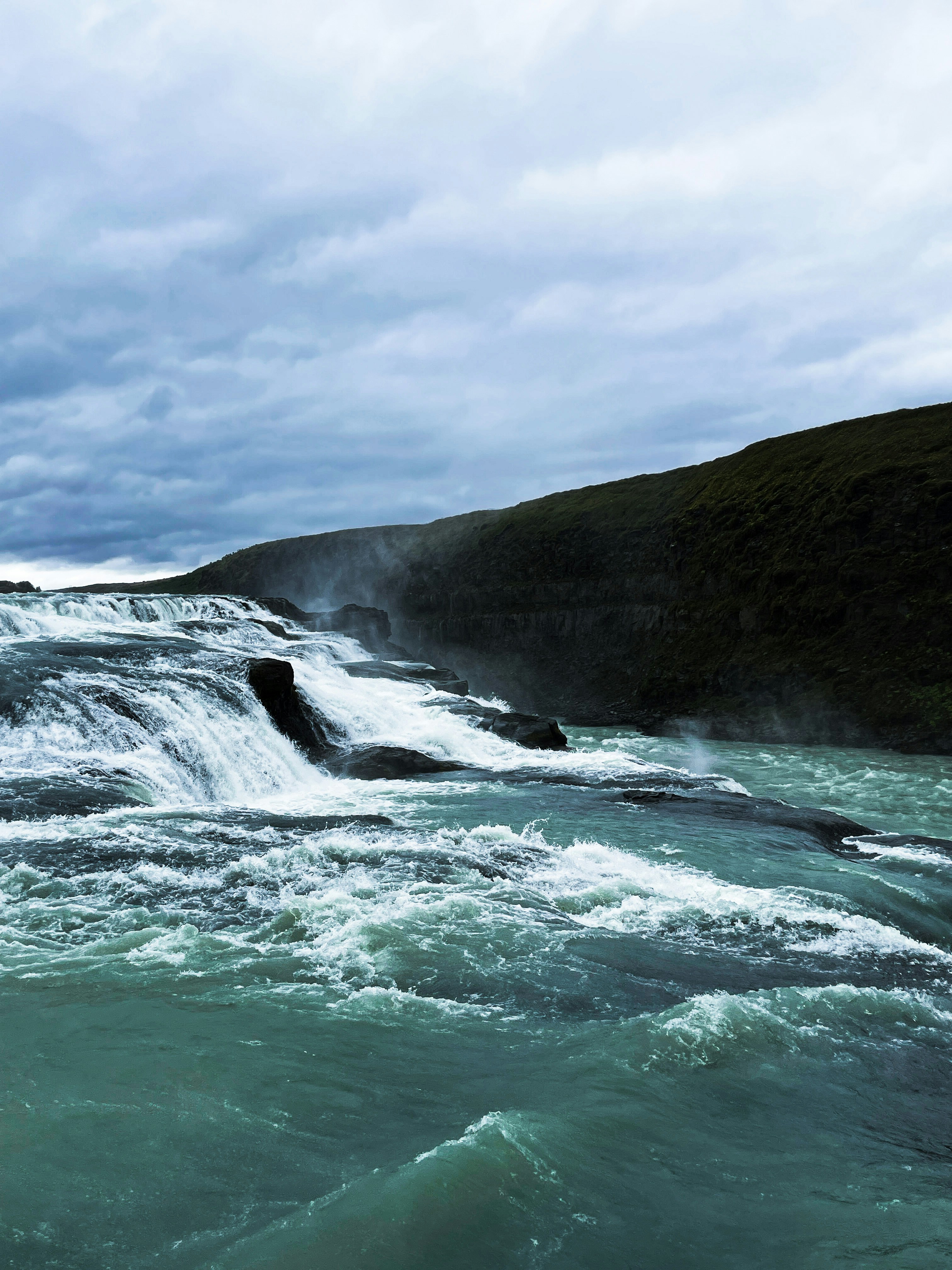 a body of water with waves crashing on it