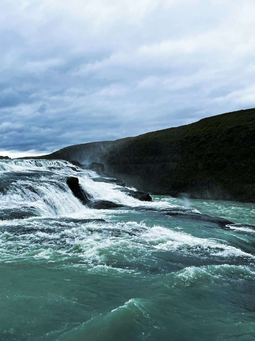 a body of water with waves crashing on it