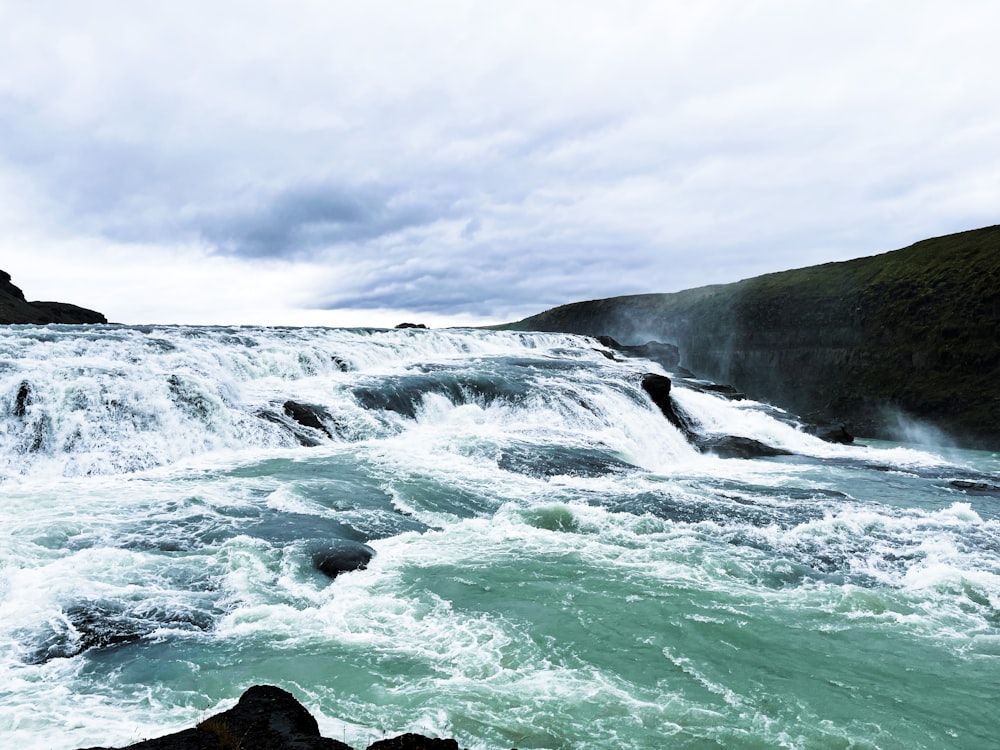 a body of water with waves crashing on it