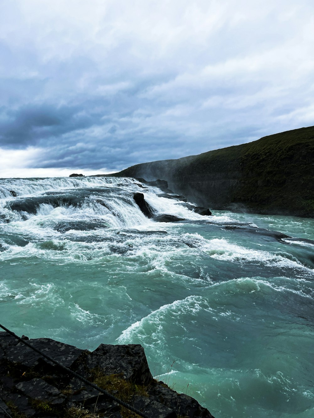 a body of water with waves crashing on it