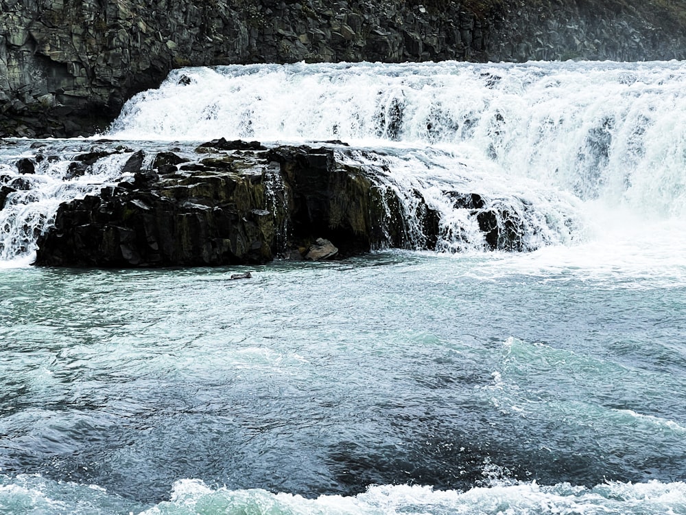 a waterfall over a cliff