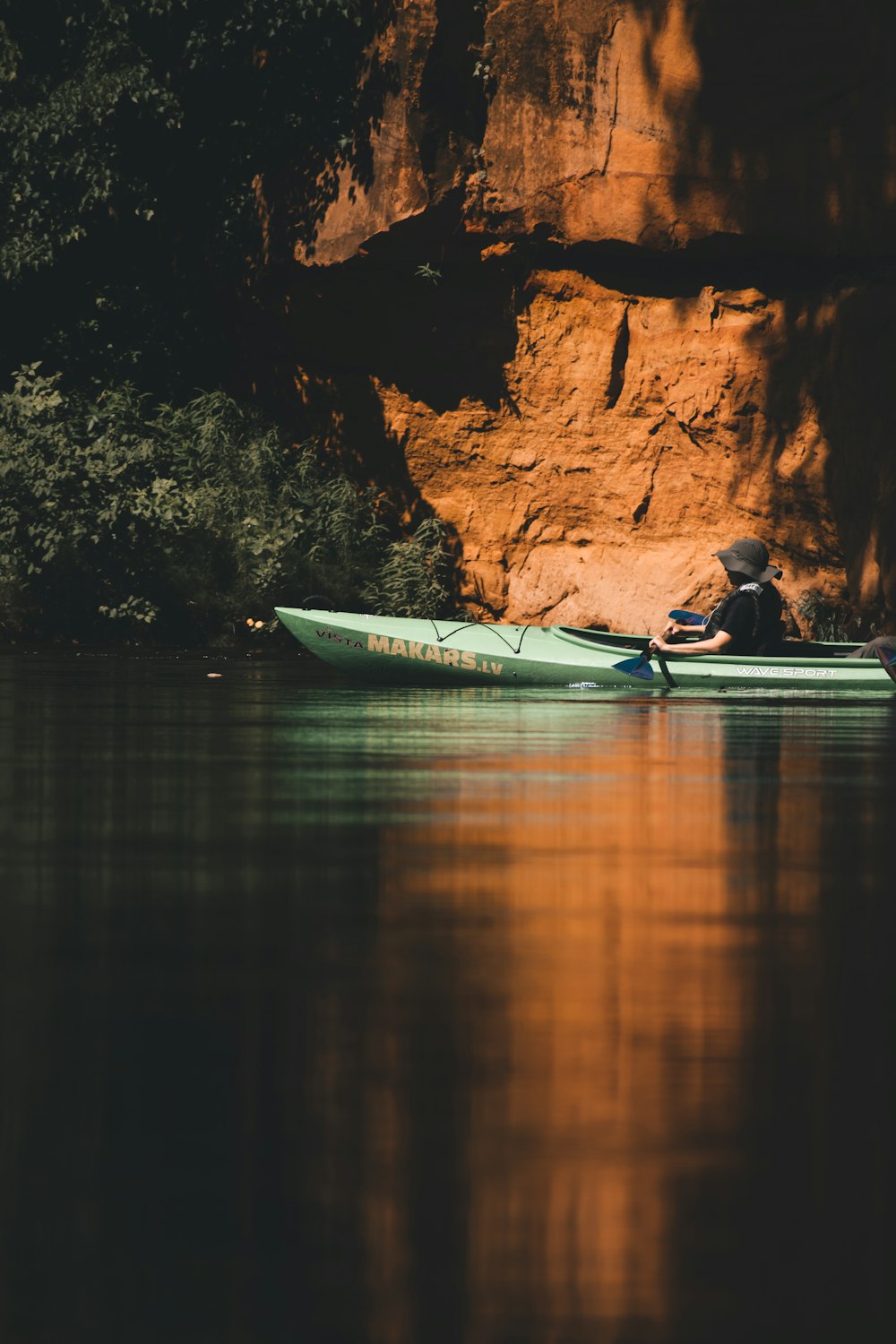 a person in a canoe in a river