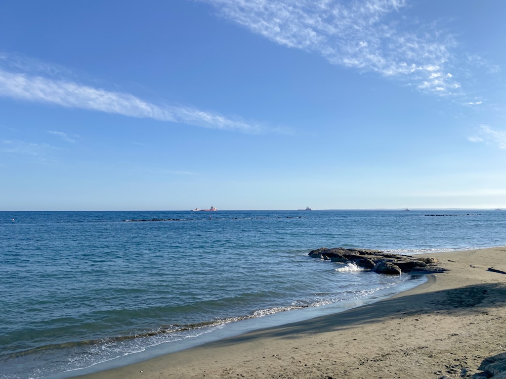 a beach with a body of water