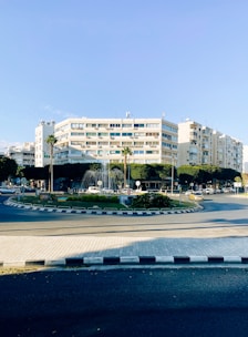 a building with a pool in front of it