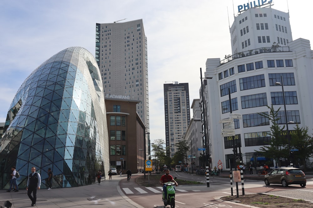 a group of people walking around a city