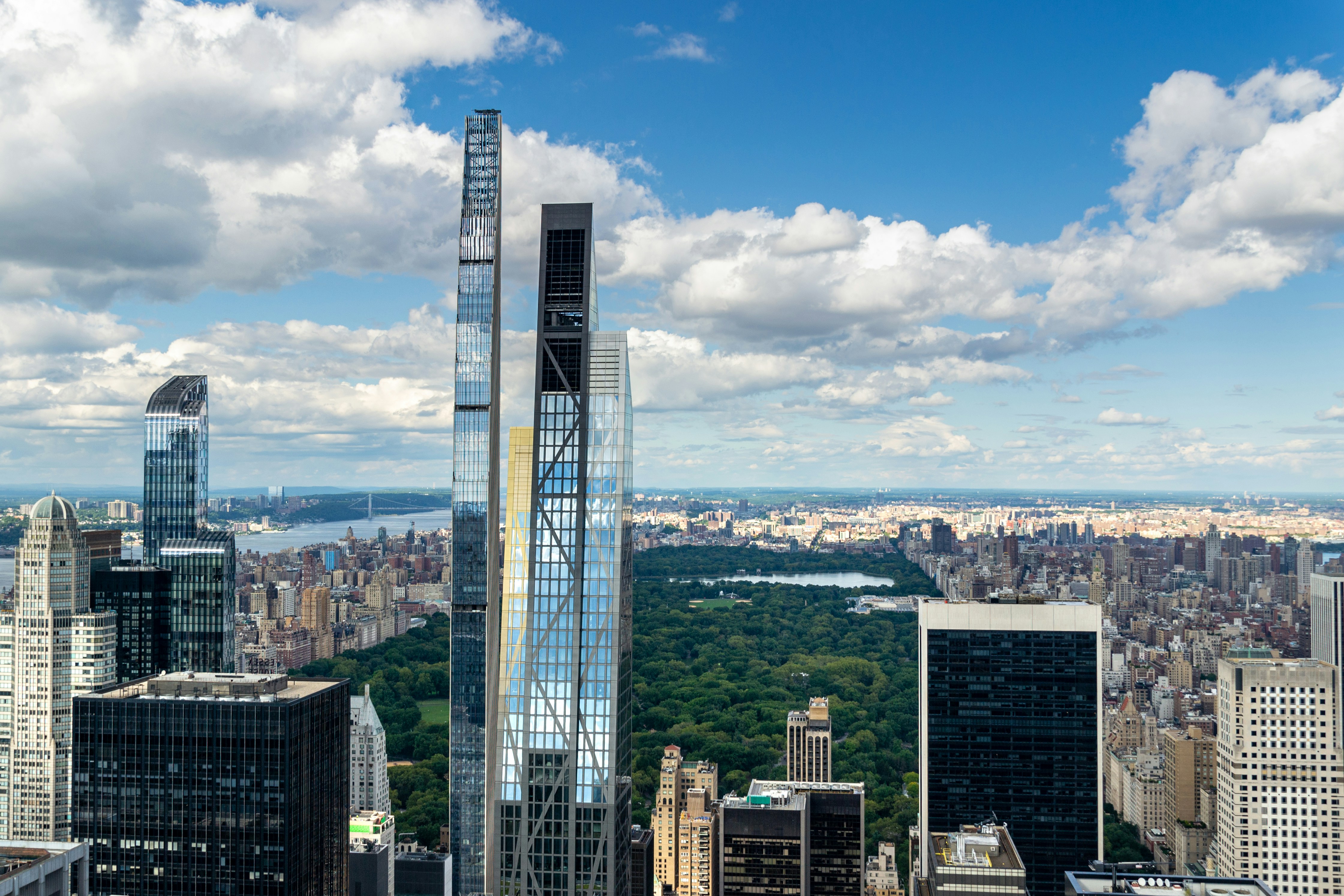 a tall glass building in a city