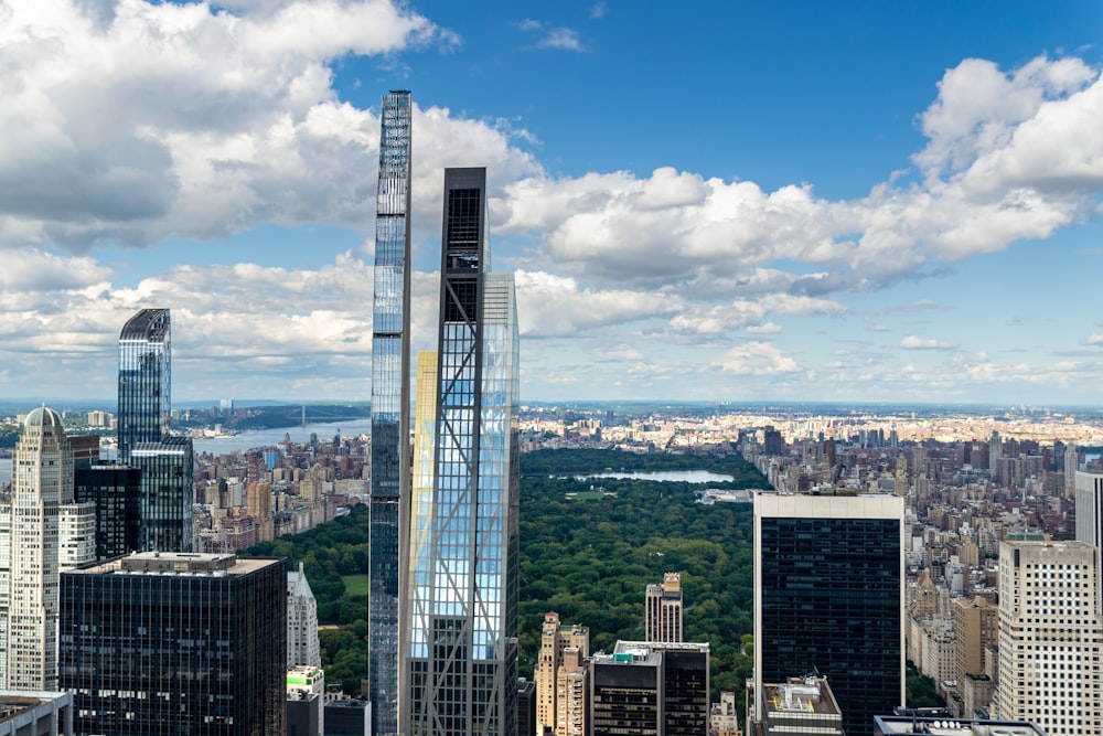 a tall glass building in a city