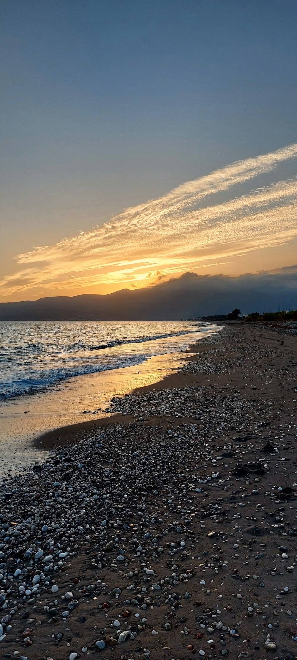 a beach with rocks and water