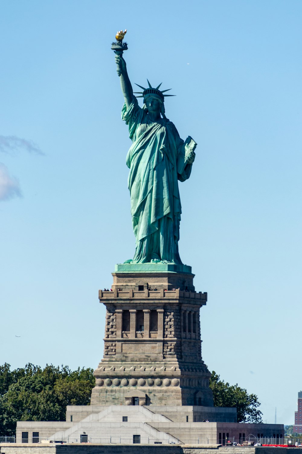 a statue of a person holding a torch