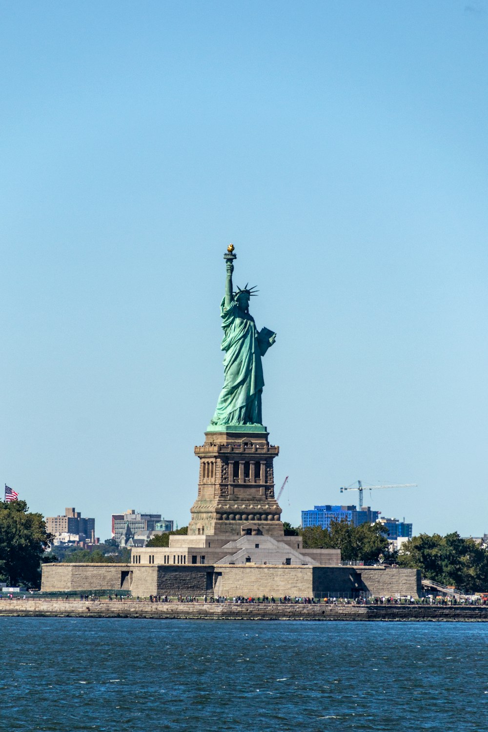 a statue of a person holding a torch