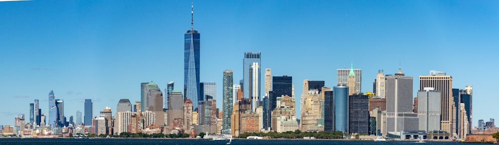 a city skyline with a blue sky