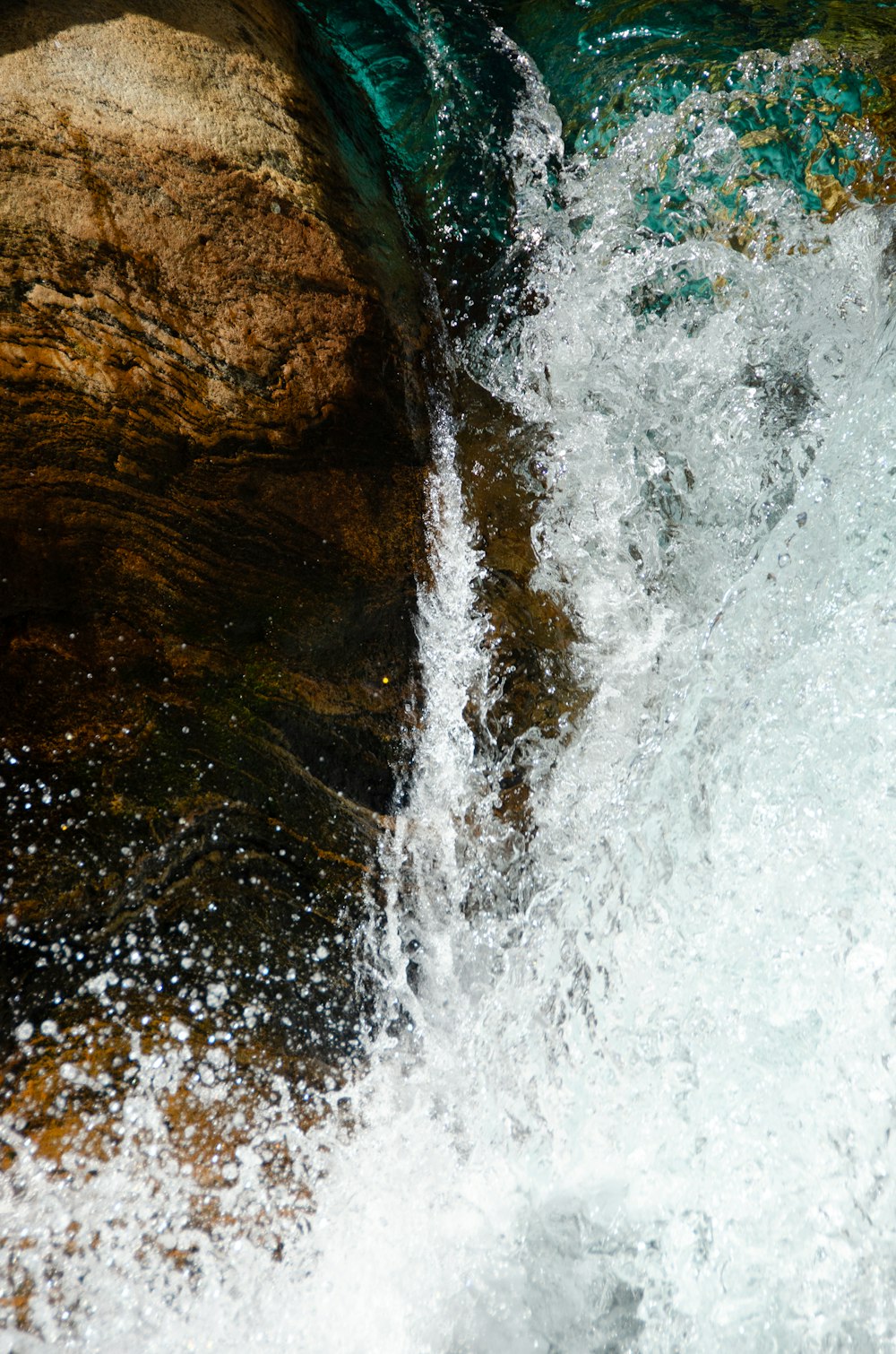 a waterfall with a rainbow