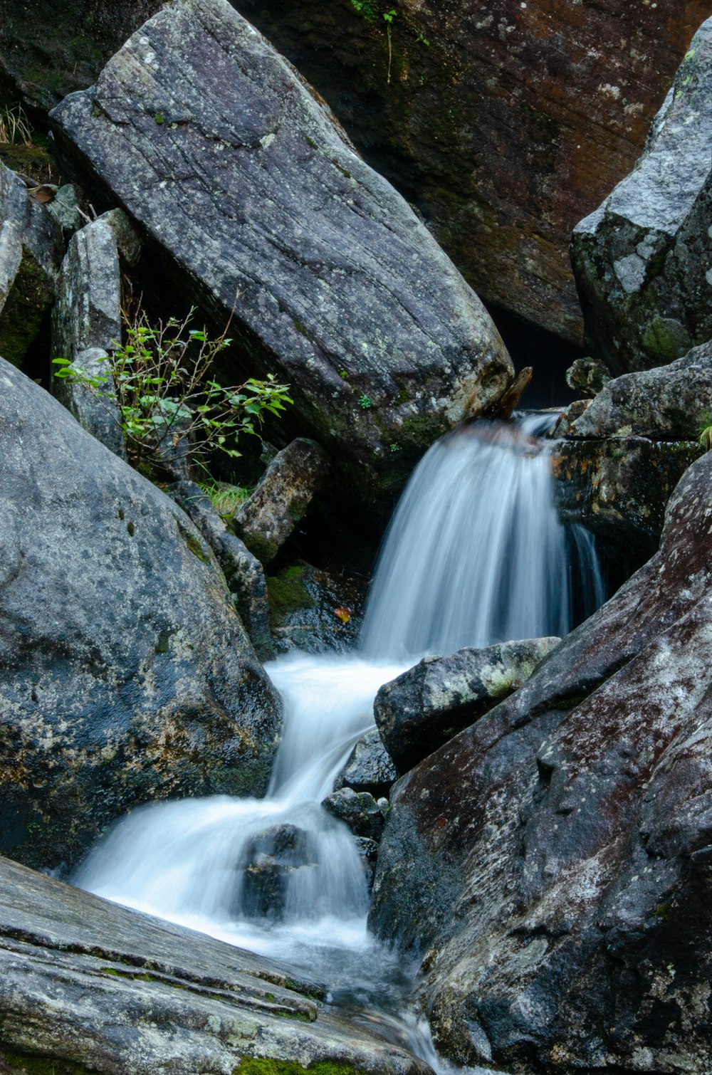 a small waterfall in a rocky place