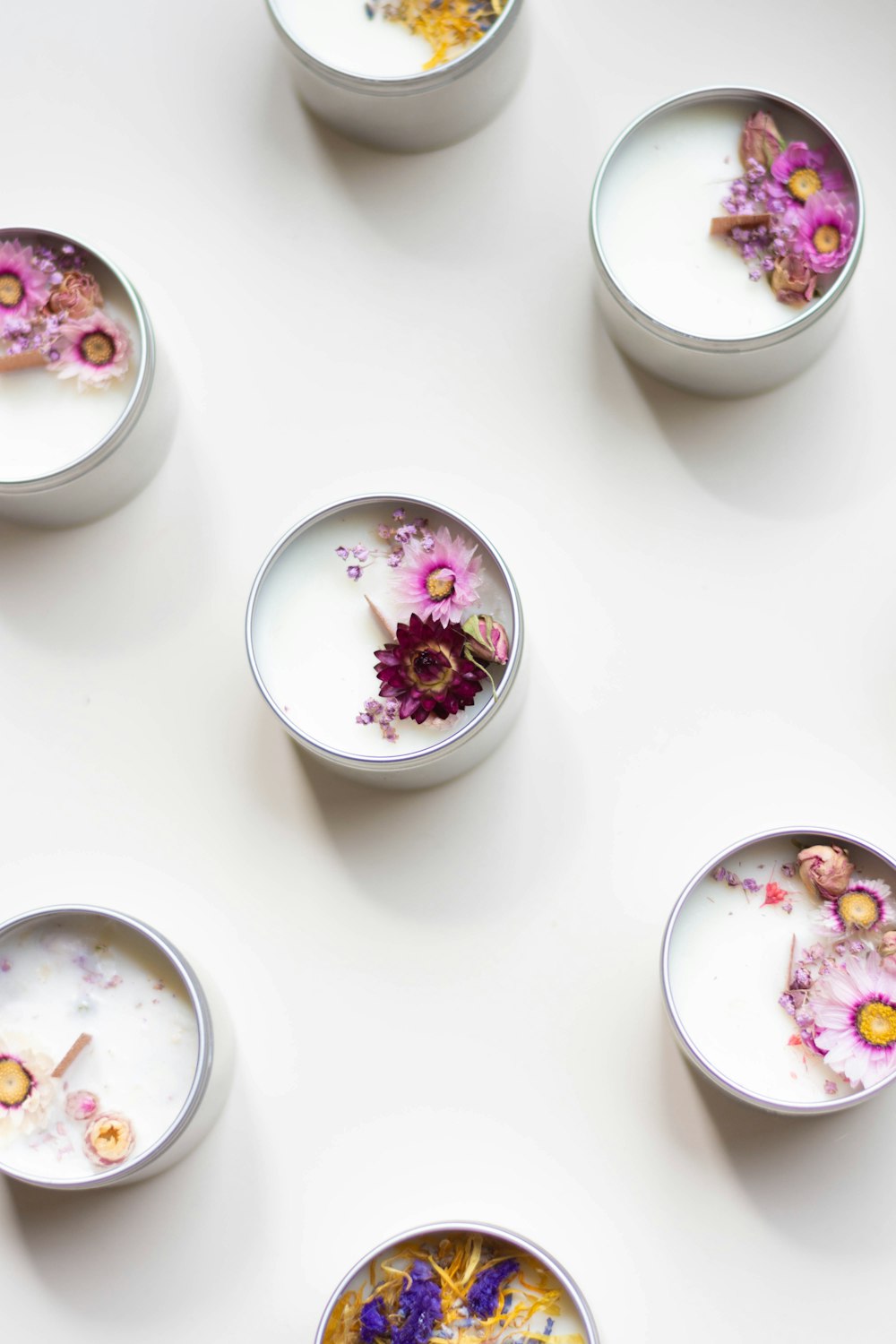 a group of bowls with colorful objects in them