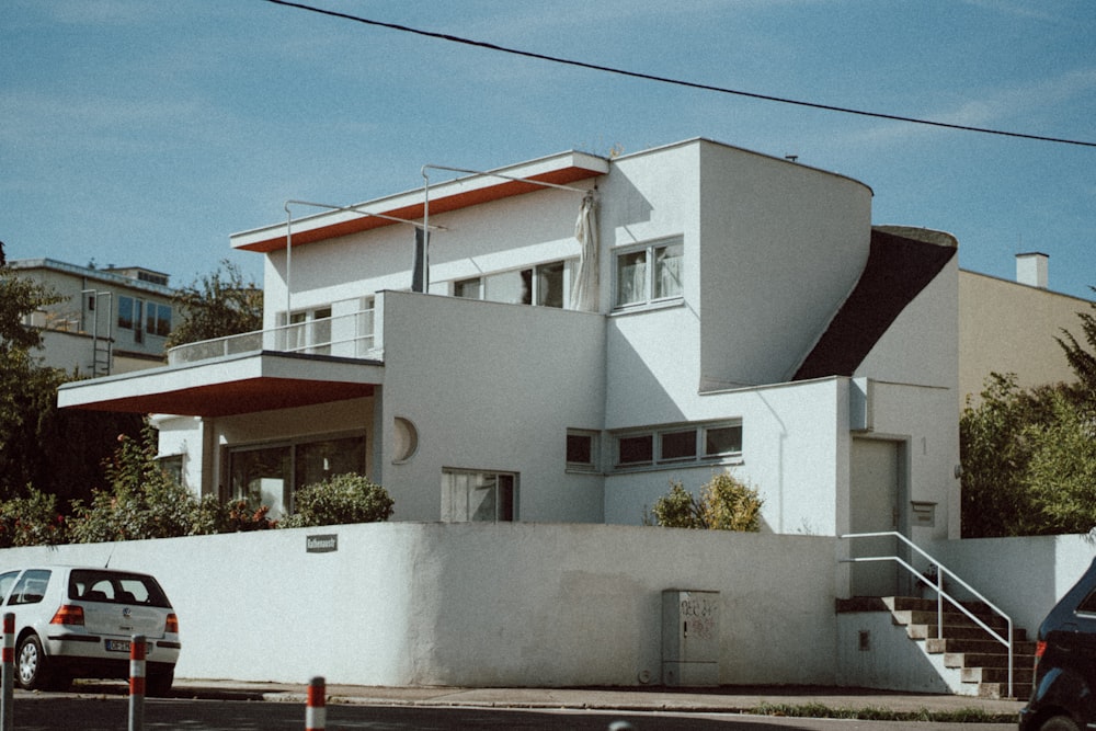 a white building with a red roof