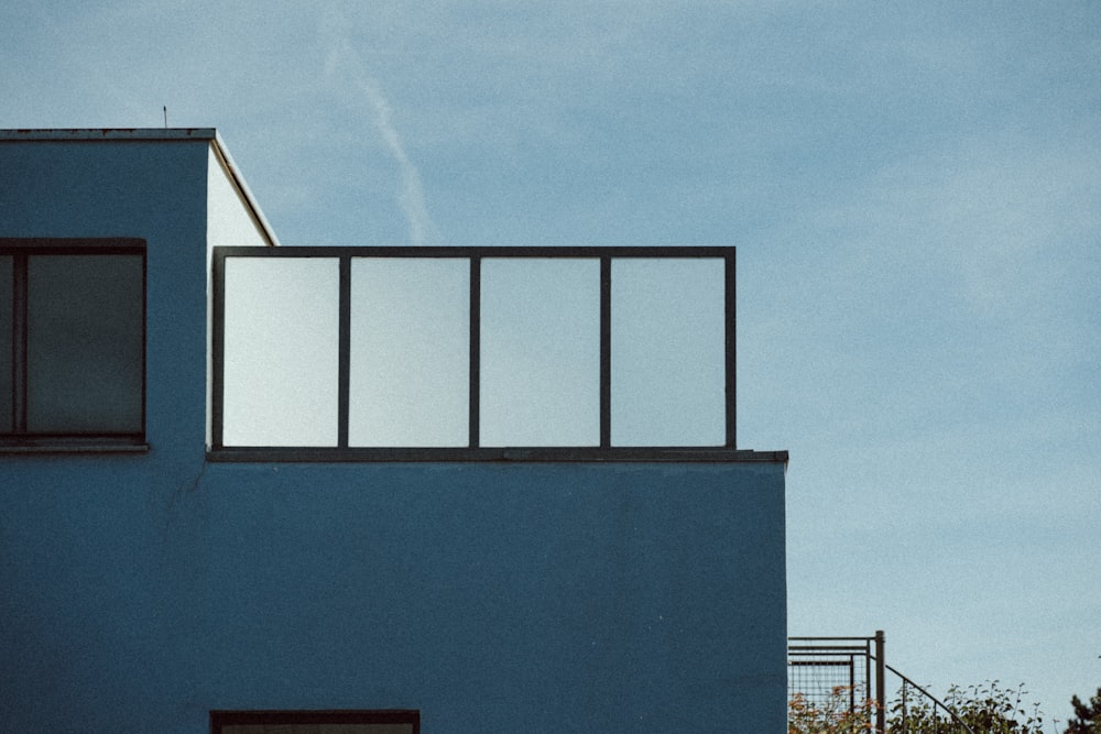 a blue building with a window