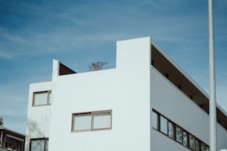 a white building with a blue sky