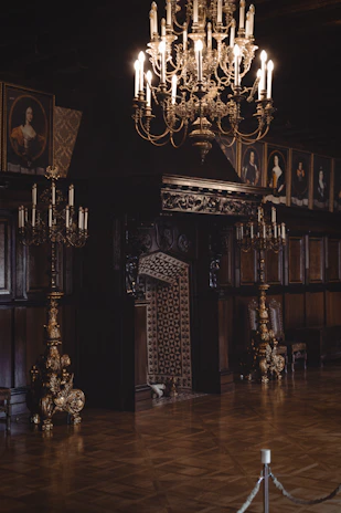 Guests enjoying a lively reception in the mansion’s elegant parlor, with period décor and soft lighting enhancing the atmosphere.