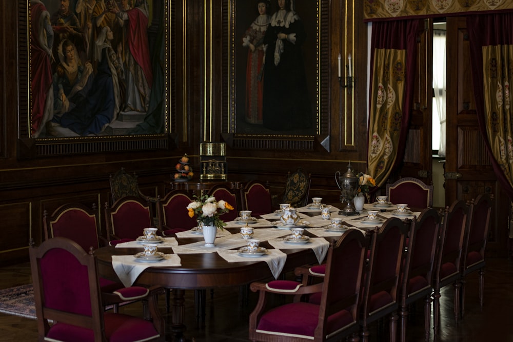 a dining room with red chairs