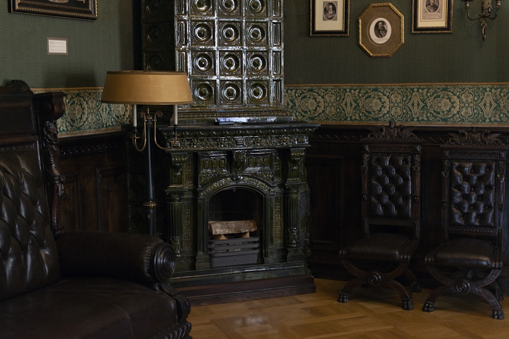 a room with a fireplace and chairs