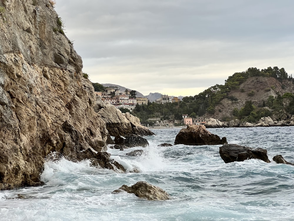 a rocky beach with a waterfall