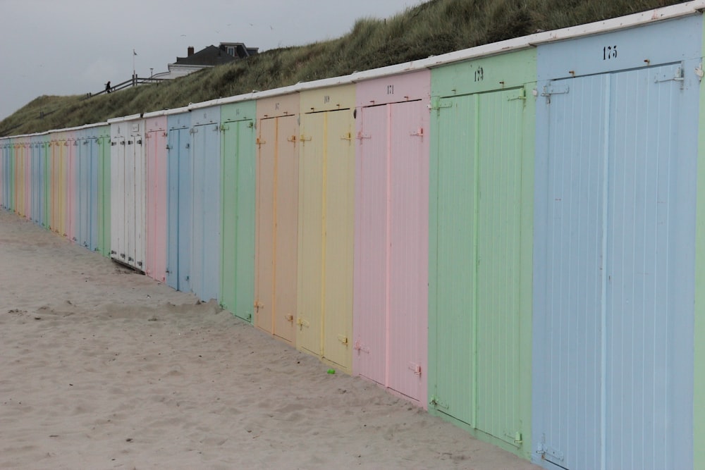 a row of colorful sheds