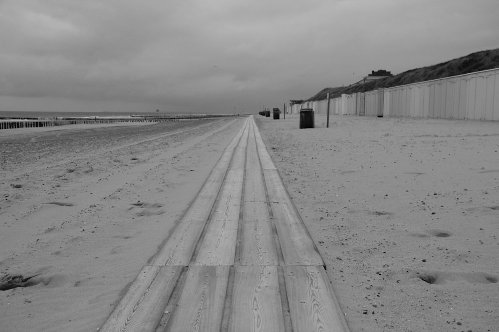 a long wooden walkway on a beach