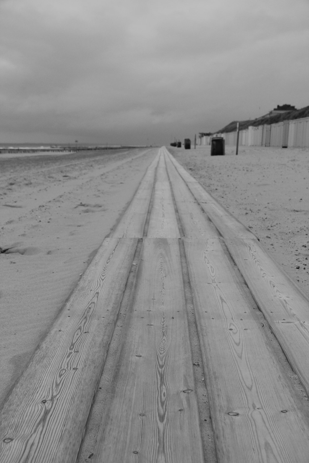 a wooden walkway on a beach