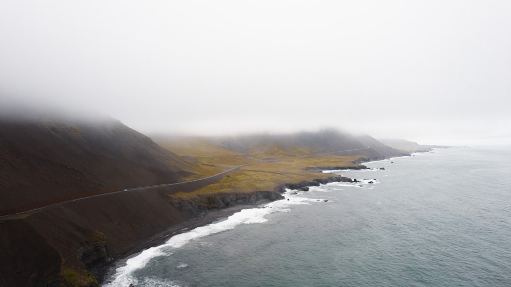 a body of water with hills around it