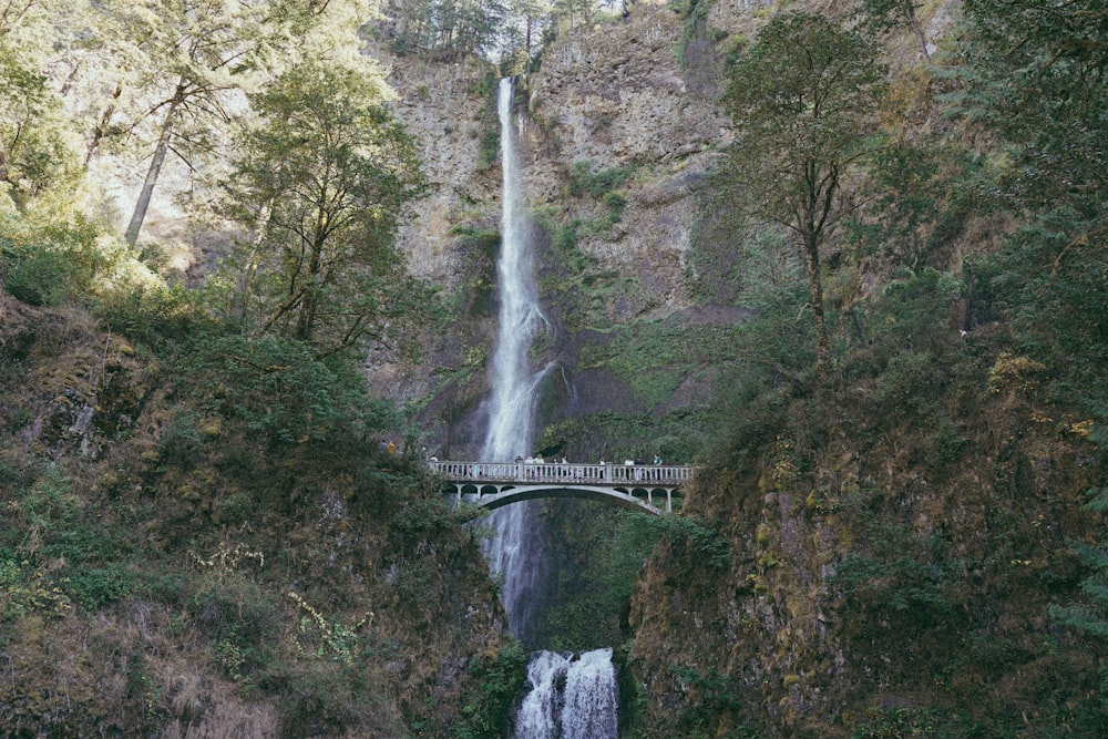 a bridge over a waterfall