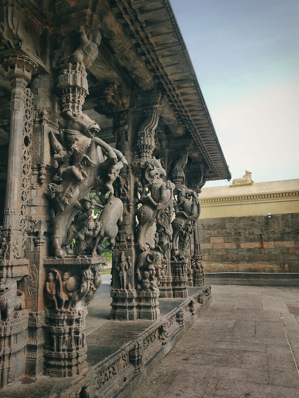 a stone building with statues