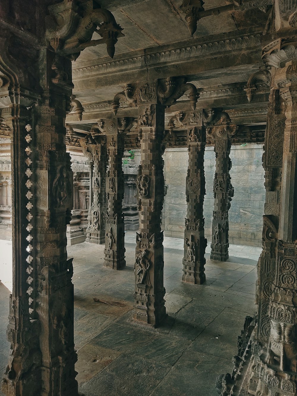 a room with pillars and statues