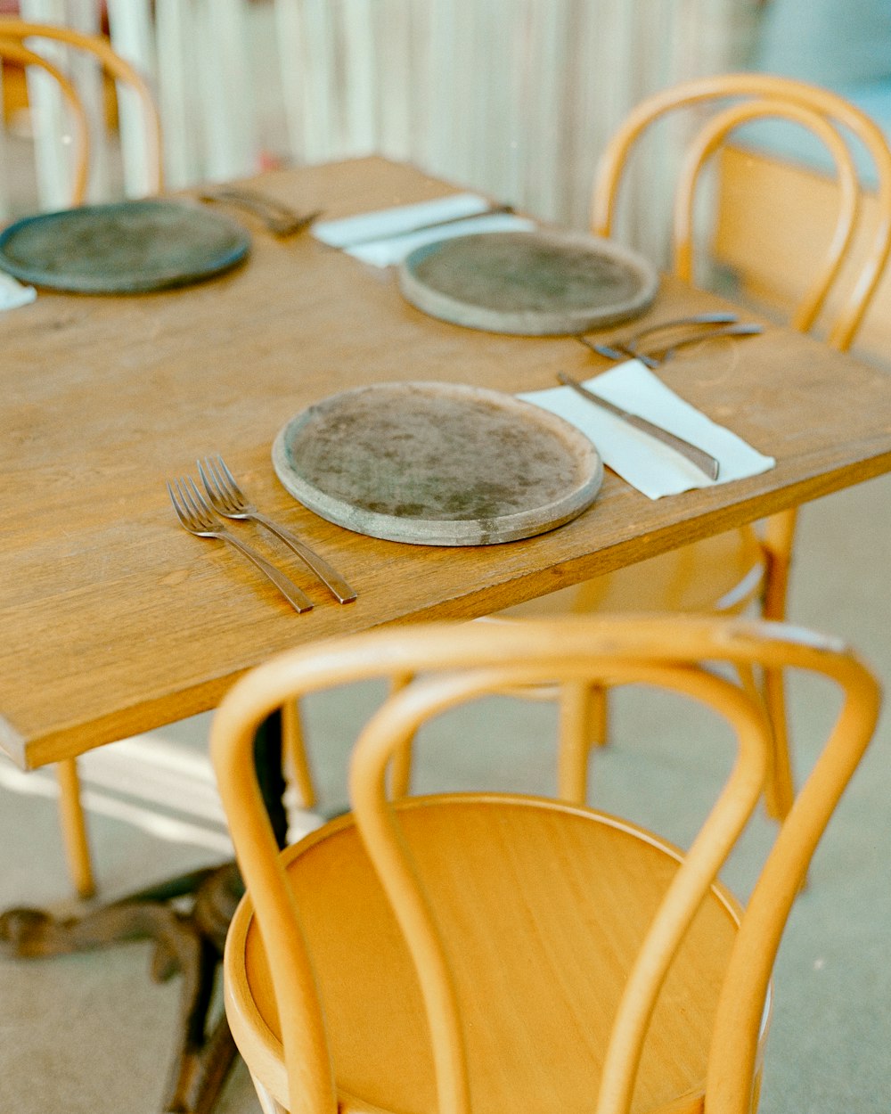 a table with plates and silverware