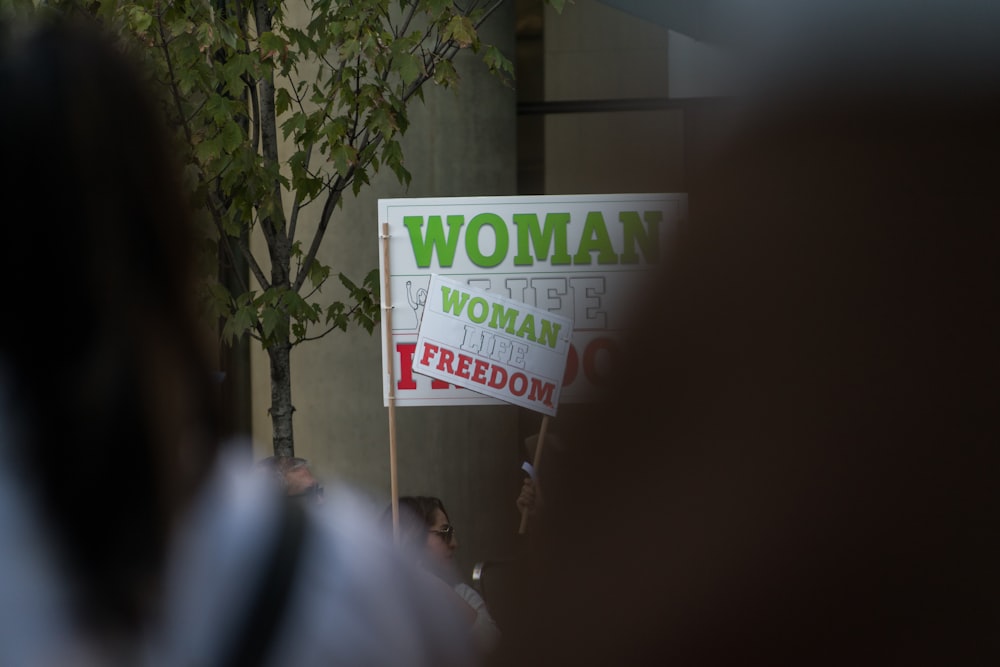 a group of people holding signs