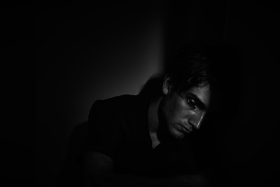 A shadowy figure in a dark setting.