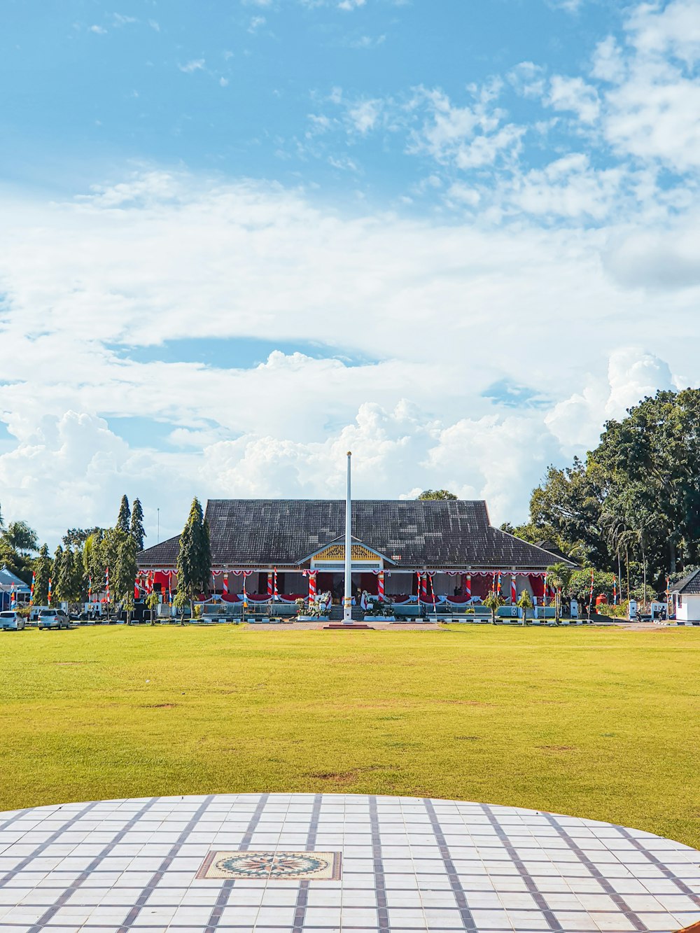 a large building with a large lawn in front of it