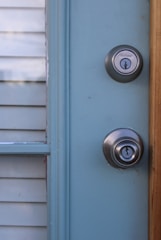 a door with a couple of knobs on it
