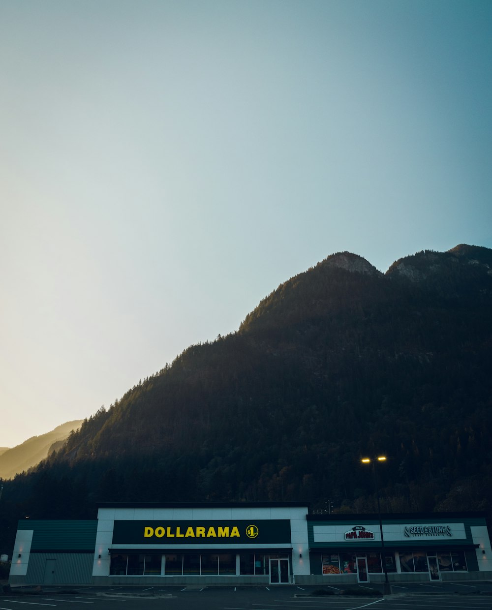 a building with a mountain in the background