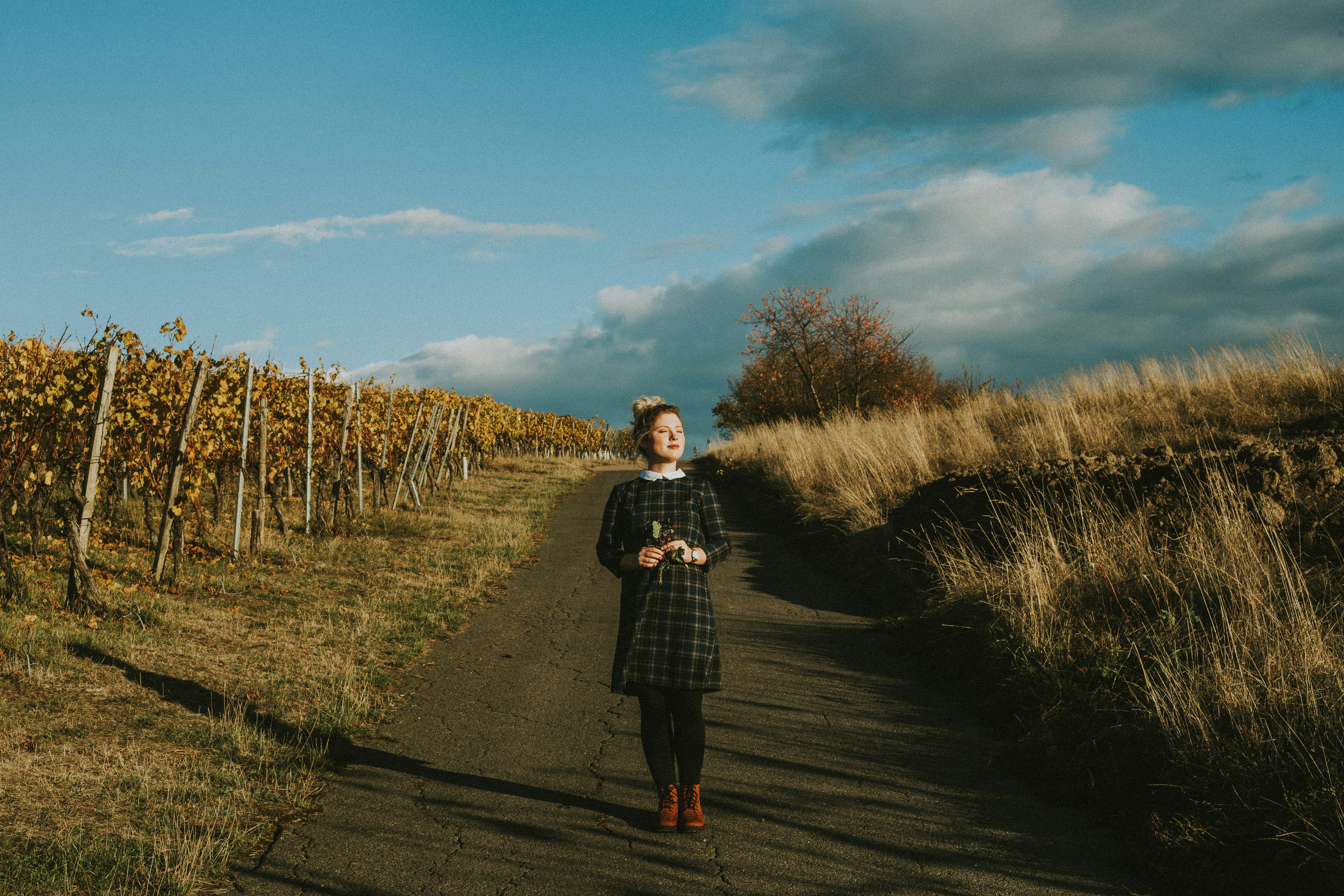 a man standing on a dirt road