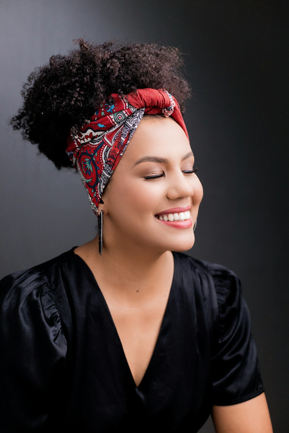 a person with a red flower crown