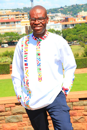 A sunny outdoor scene with a customer trying on a Coco Cat shirt, smiling and enjoying the moment.