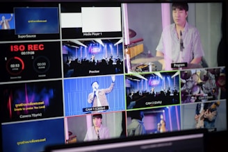 A multi-screen display showing various camera angles and views of a music or worship event. The screens include a live audience, performers on a stage, close-ups of a drummer, and a person speaking or singing. There are also overlay texts with labels such as 'ISO REC', 'Preview', and different camera numbers.