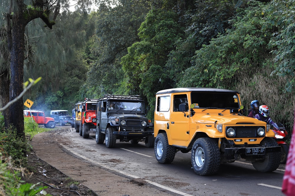 a group of vehicles are parked on the side of the road